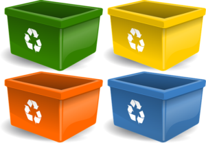 Four recycling bins in four different colors with recycling symbol on each